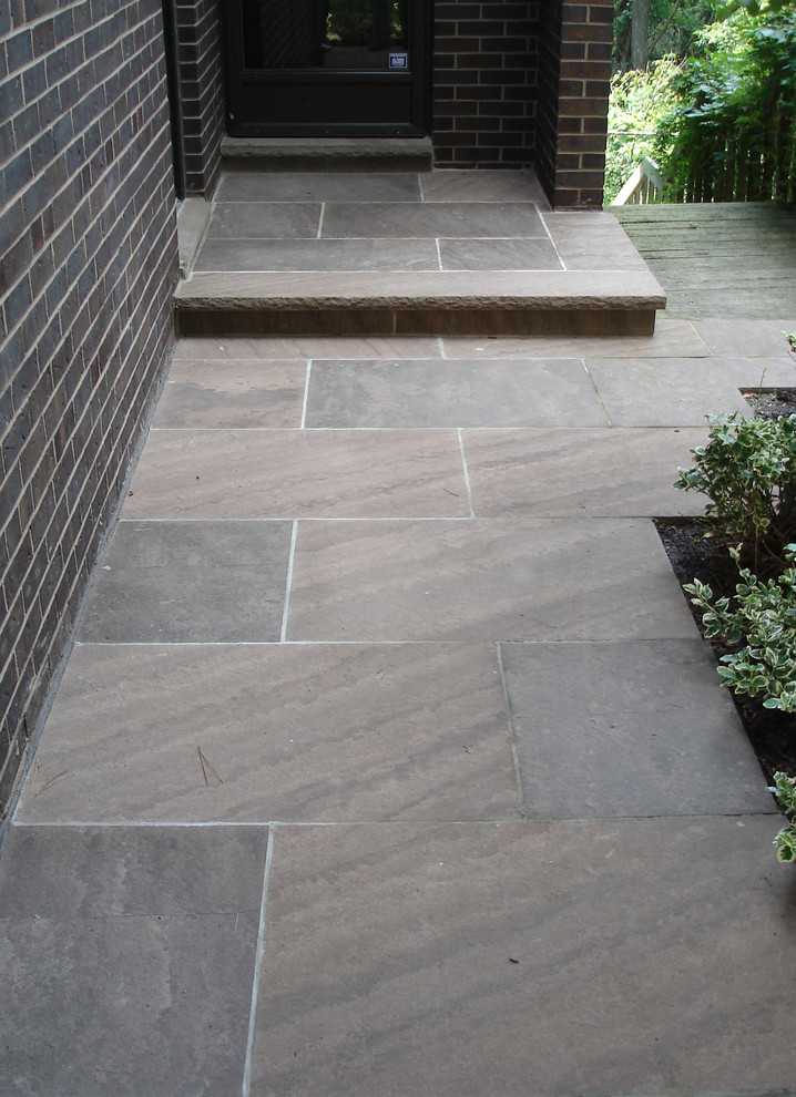Contemporary patio in Charlotte with concrete paving.
