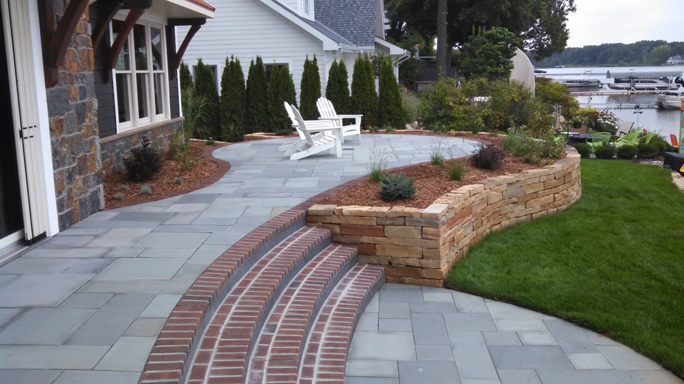 Design ideas for a classic back patio in Grand Rapids with stamped concrete.