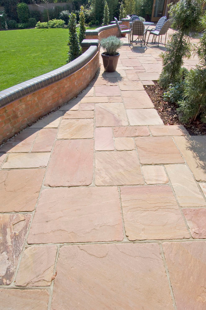 Design ideas for a bohemian patio in Oxfordshire with natural stone paving.