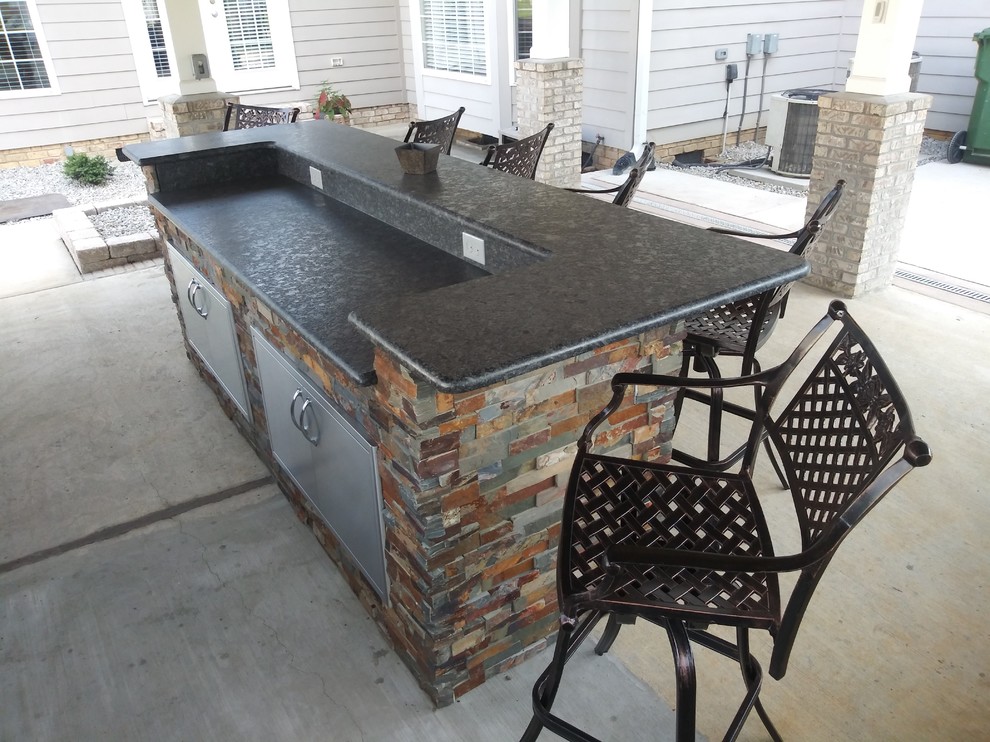 Inspiration for a mid-sized transitional backyard concrete patio kitchen remodel in Raleigh with a gazebo