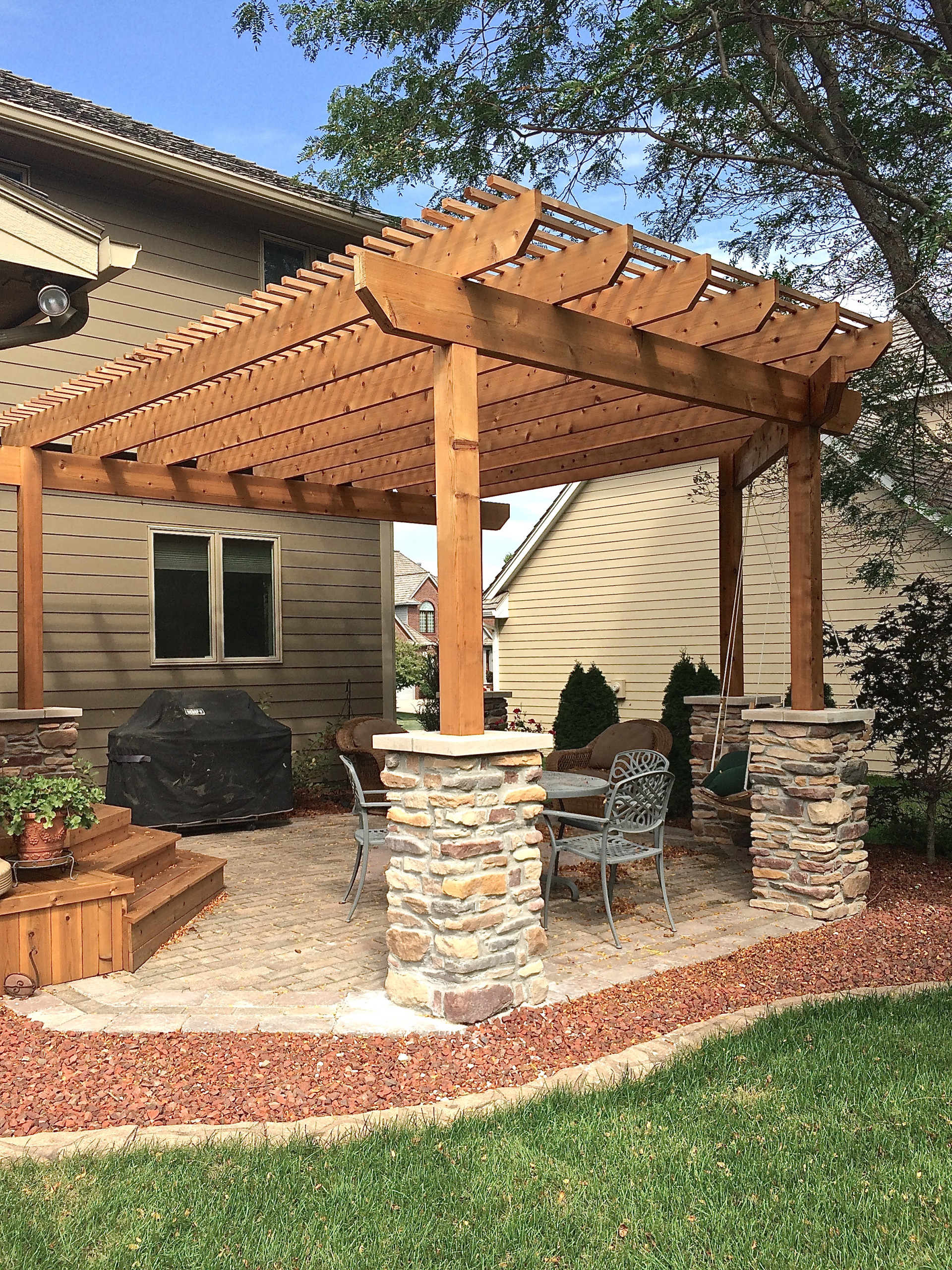 Paver Patio With Cedar Pergola Veneer Stone Columns Swing Traditional Other By Archadeck Of Central Iowa Houzz - How To Build A Pergola On Paver Patio