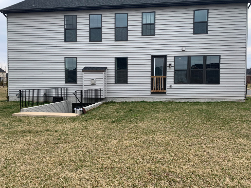 Paver Patio with outdoor kitchen, sitting wall and fire pit. Modern