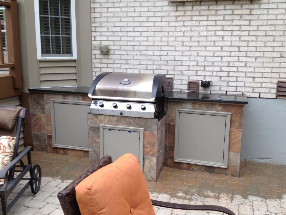 paver patio with pit seating wall and grill trex steps. Traditional
