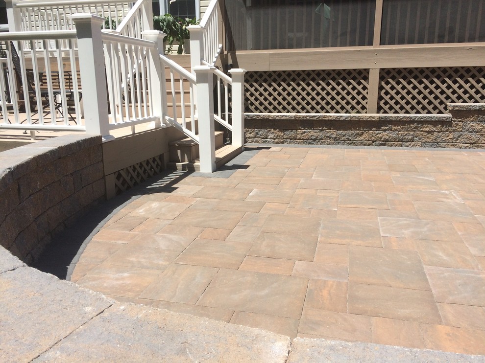 Mid-sized mountain style backyard concrete paver patio photo in Wilmington with no cover