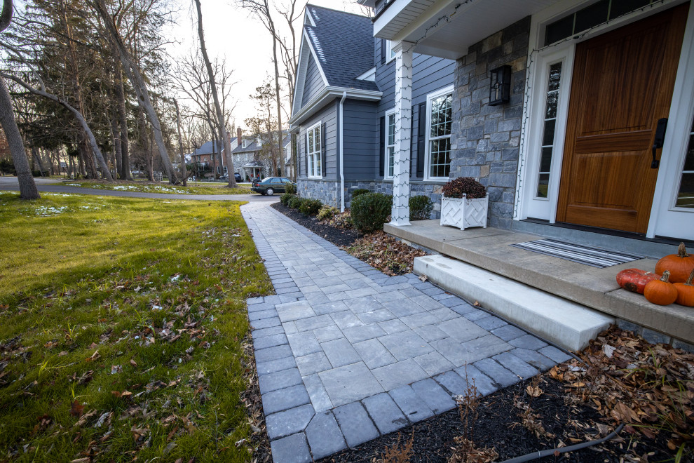 Design ideas for a small modern front patio in Philadelphia with concrete paving.