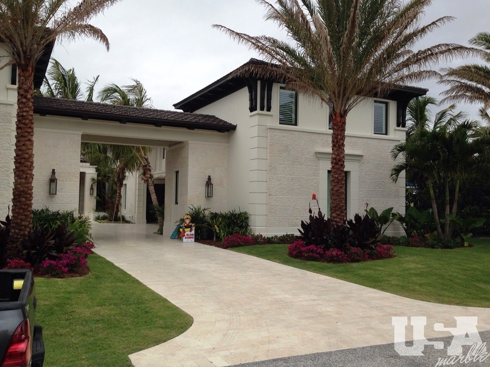 Inspiration for a huge modern front yard stone patio remodel in Miami