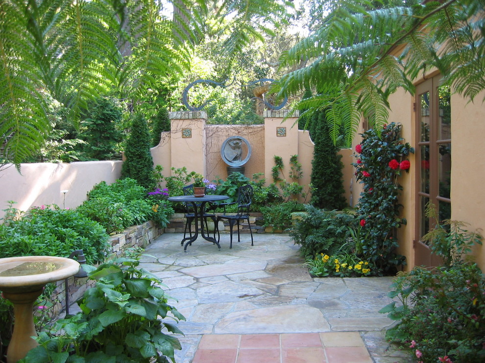 Patio - mediterranean courtyard patio idea in Other