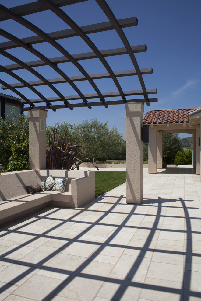Example of a tuscan patio design in San Francisco with a pergola