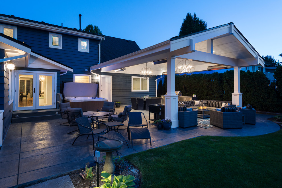 Design ideas for a large classic back patio in Vancouver with an outdoor kitchen, stamped concrete and a pergola.
