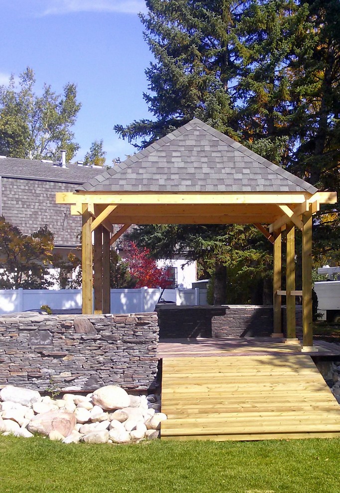 Pergola and Outdoor BBQ area Traditional Patio Calgary by