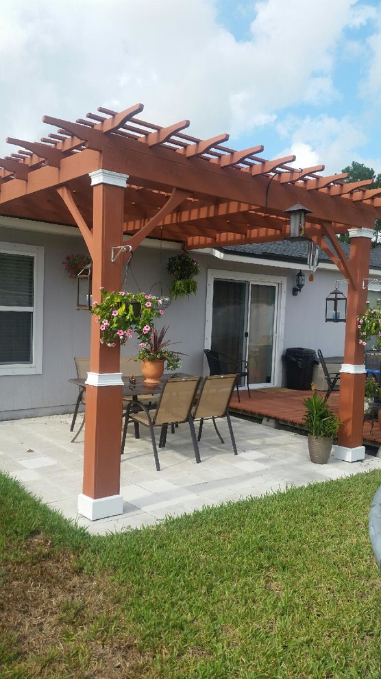 This is an example of a medium sized mediterranean back patio in Jacksonville.