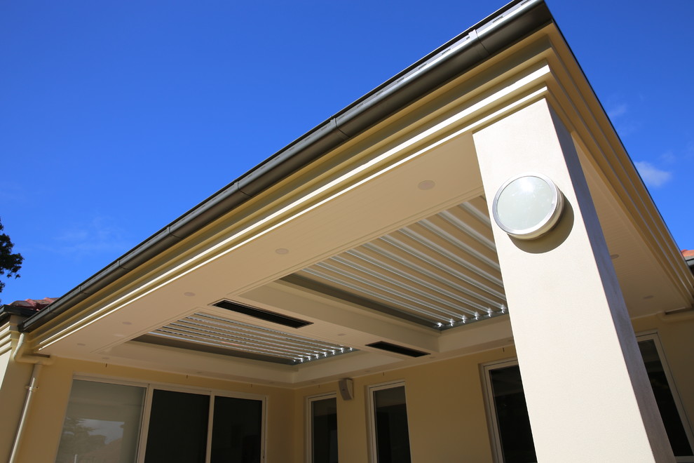 Inspiration for a medium sized traditional back patio in Sydney with a pergola.