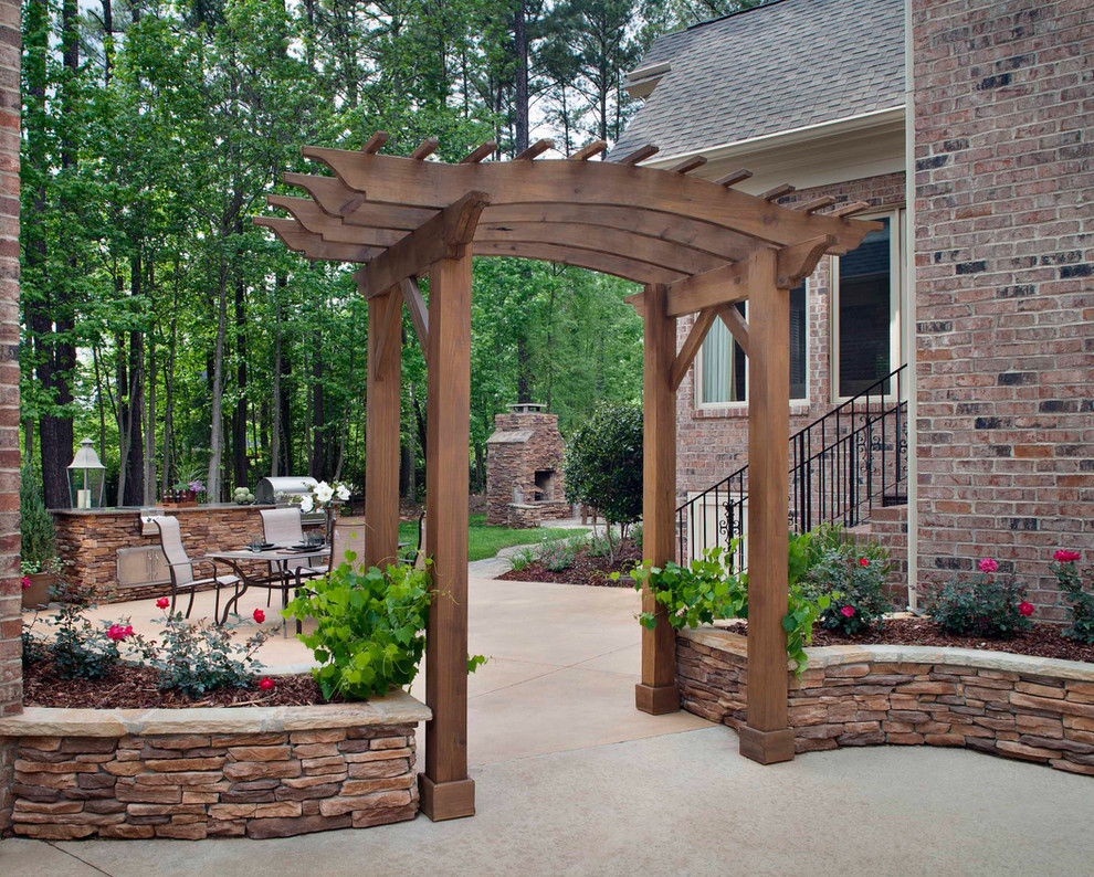 Inspiration for a classic back patio in Portland with brick paving and a pergola.