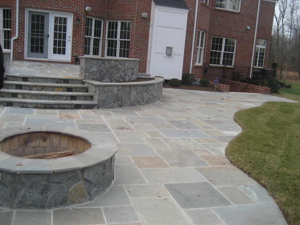 Patio - mid-sized traditional backyard brick patio idea in DC Metro with a fire pit and no cover