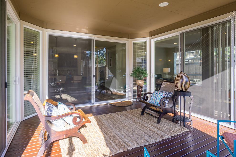 Medium sized contemporary back patio in Seattle with a fire feature, decking and no cover.