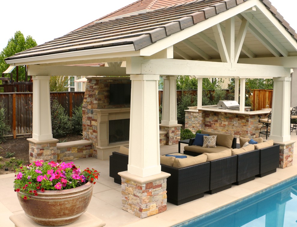 Inspiration for a large transitional backyard concrete paver patio remodel in San Francisco with a fire pit and a gazebo