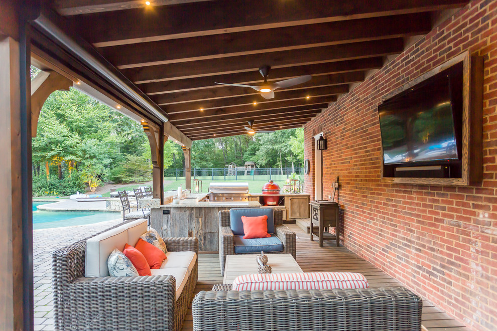 Patio - rustic backyard patio idea in Atlanta with a roof extension