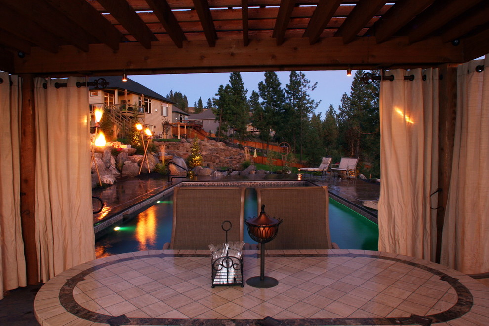 Inspiration for a medium sized contemporary back patio in Seattle with concrete paving and a gazebo.