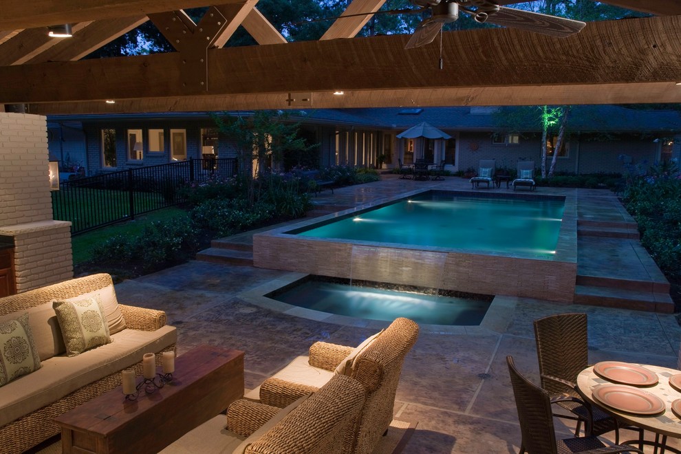 Large contemporary patio in Houston with a water feature, stamped concrete and a gazebo.