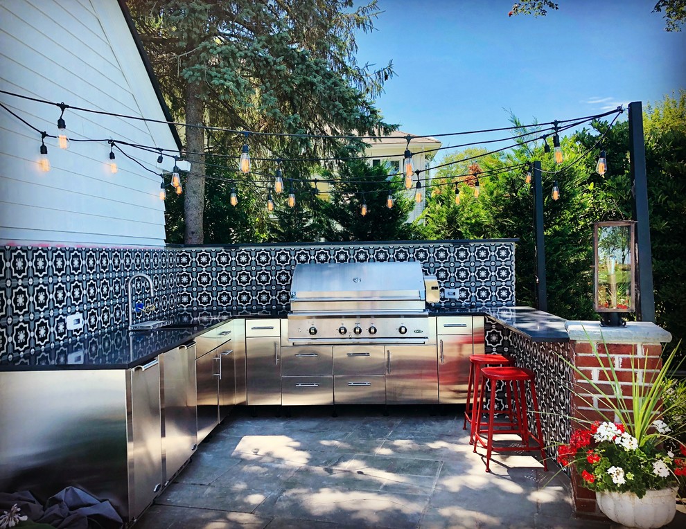 Mid-sized transitional concrete paver patio kitchen photo in New York with no cover