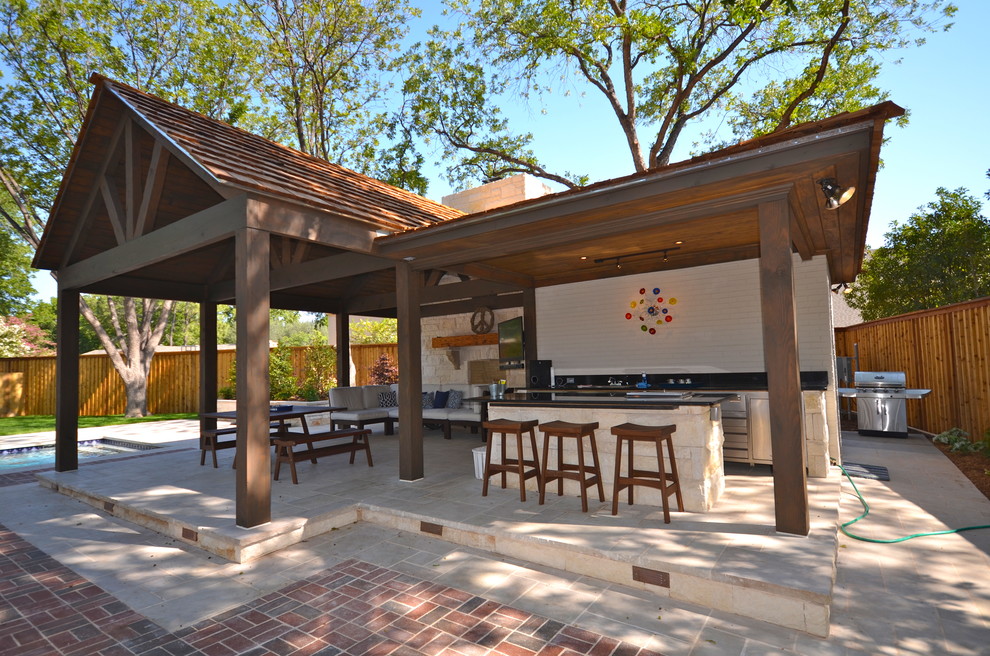 Design ideas for a medium sized classic back patio in Austin with an outdoor kitchen, concrete paving and a pergola.