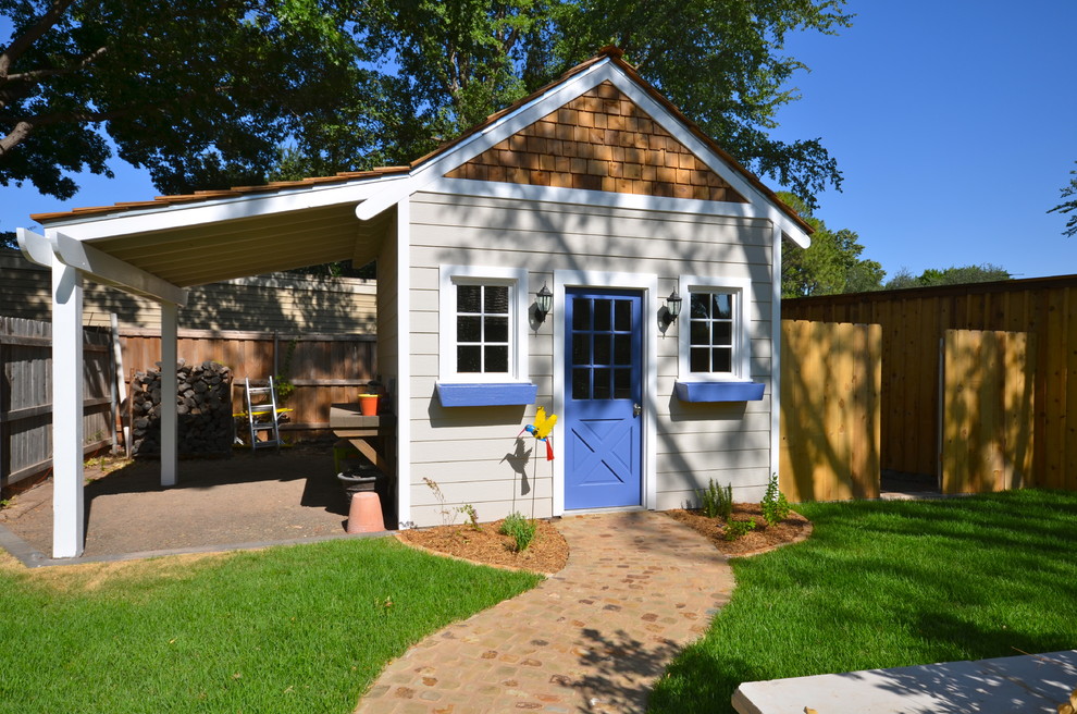 Imagen de patio de estilo americano de tamaño medio en patio trasero con cocina exterior, adoquines de hormigón y pérgola