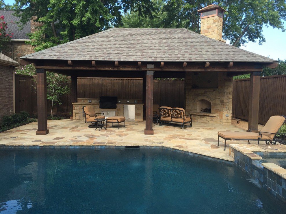 Inspiration for a medium sized rustic back patio in Dallas with an outdoor kitchen, natural stone paving and a gazebo.