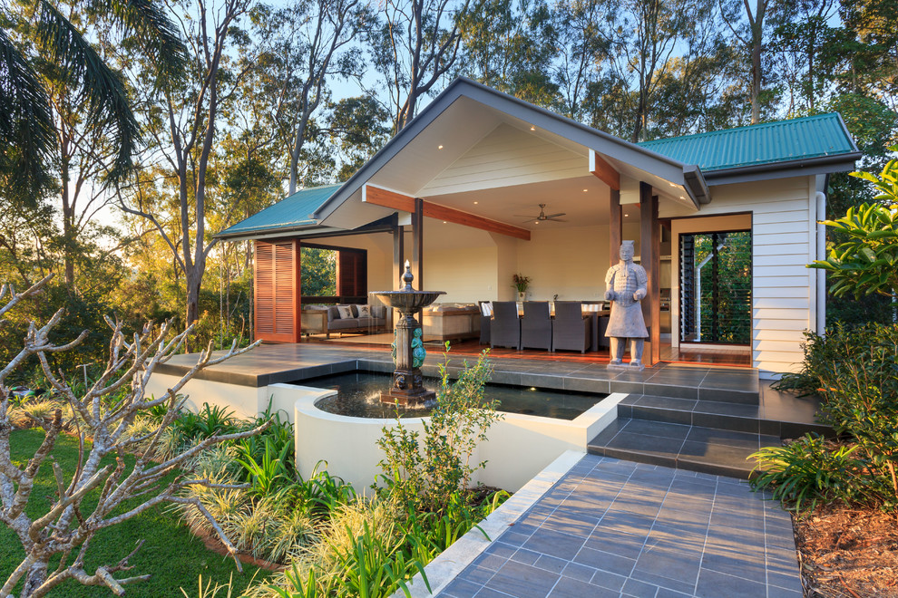 Inspiration for a world-inspired patio in Brisbane with a gazebo and a water feature.