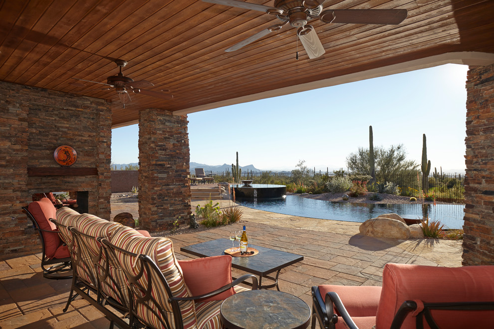 Photo of a patio in Phoenix with a roof extension.