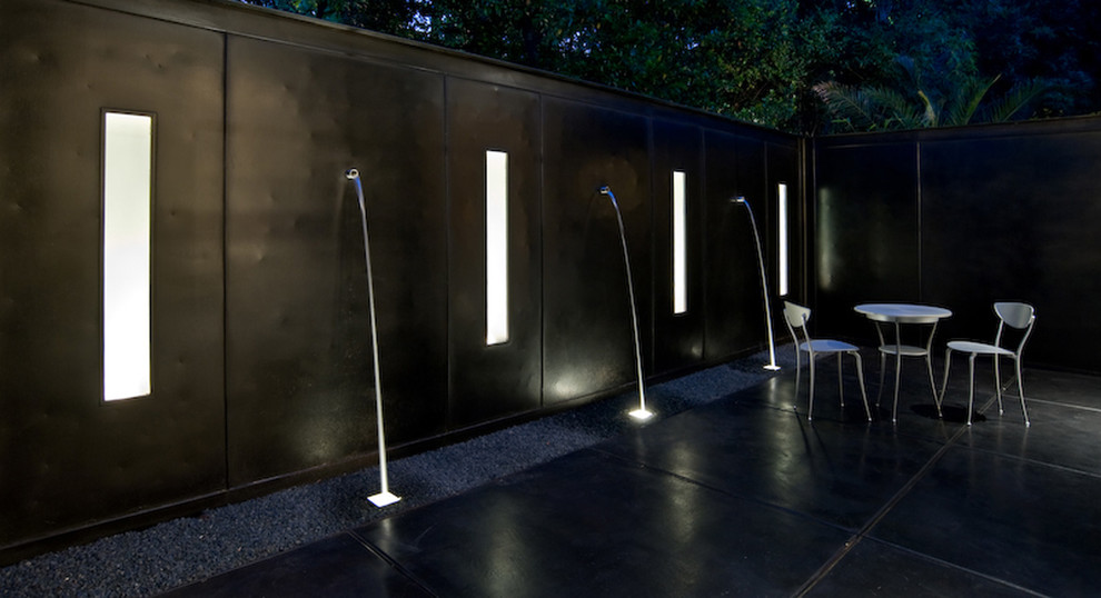 Design ideas for a contemporary patio in Austin with a water feature.