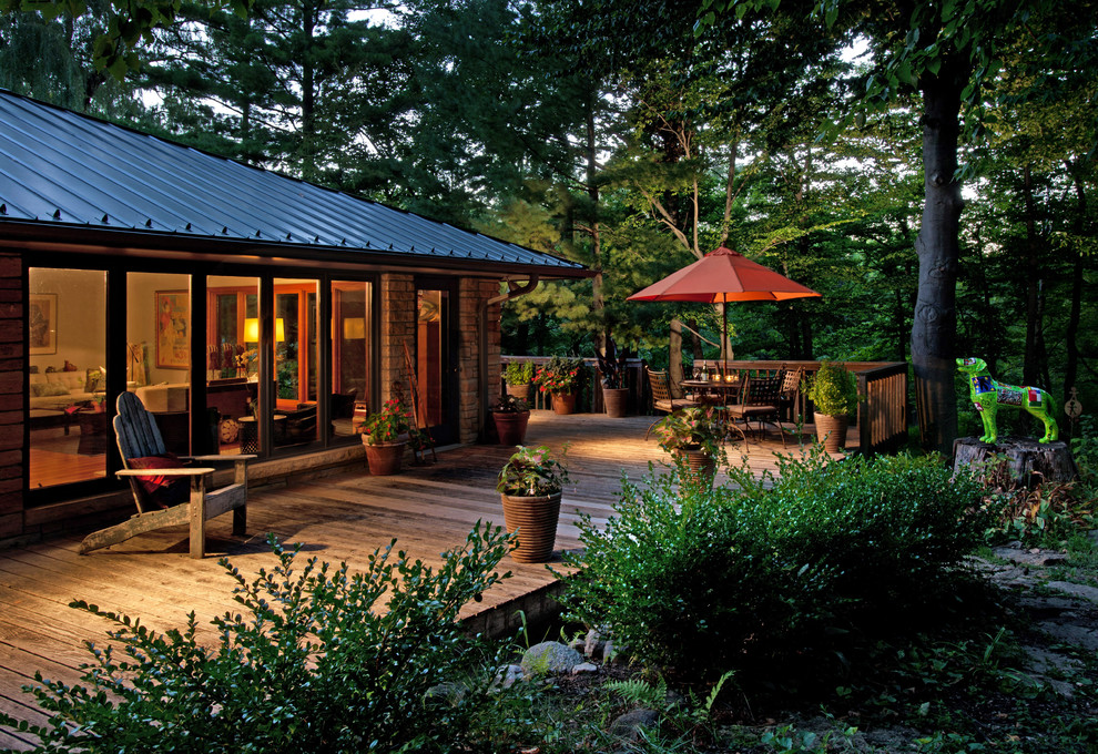 Inspiration for a large timeless side yard patio remodel in Milwaukee with decking and no cover
