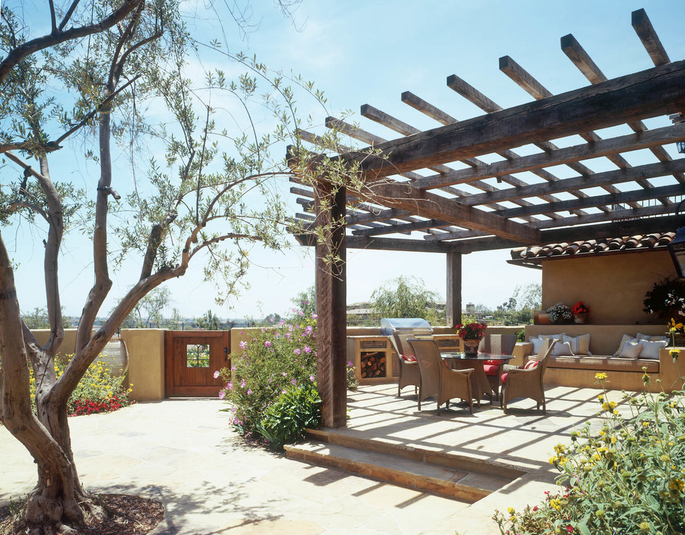 Mediterranean patio in San Diego with a pergola and a bbq area.
