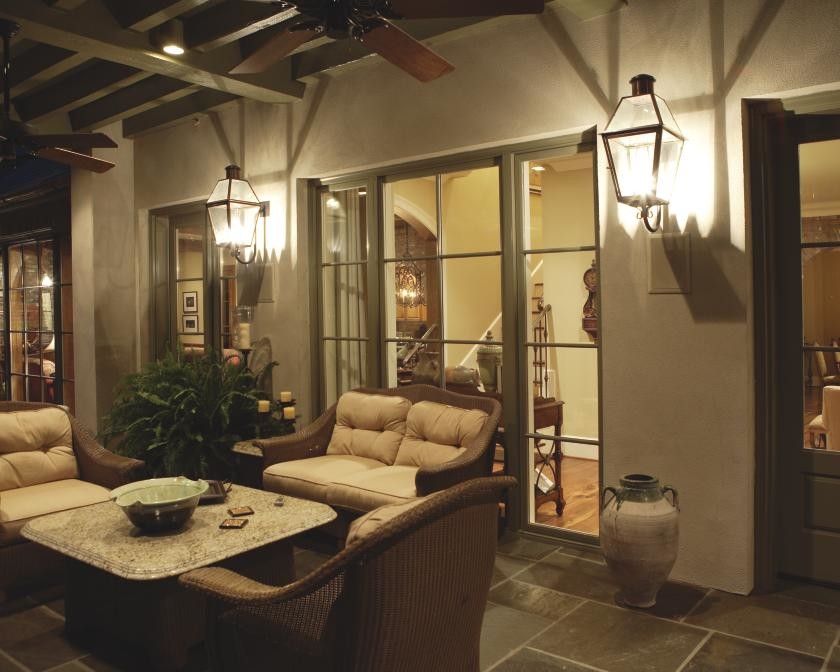 Inspiration for a mid-sized craftsman backyard tile patio remodel in Oklahoma City with a roof extension