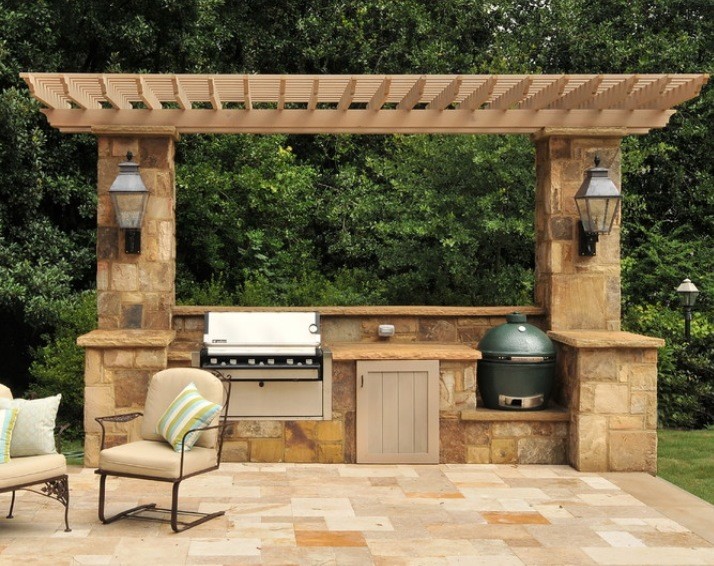 Design ideas for a medium sized mediterranean back patio in Tampa with an outdoor kitchen, stamped concrete and a pergola.