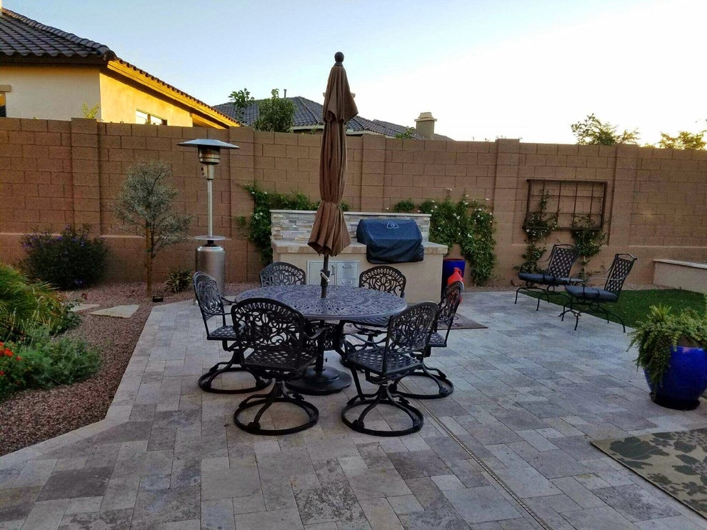 Inspiration for a medium sized traditional back patio in San Diego with a fire feature, natural stone paving and no cover.