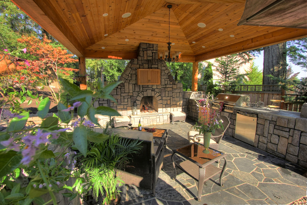 Inspiration for a contemporary patio remodel in Portland with a gazebo and a fire pit