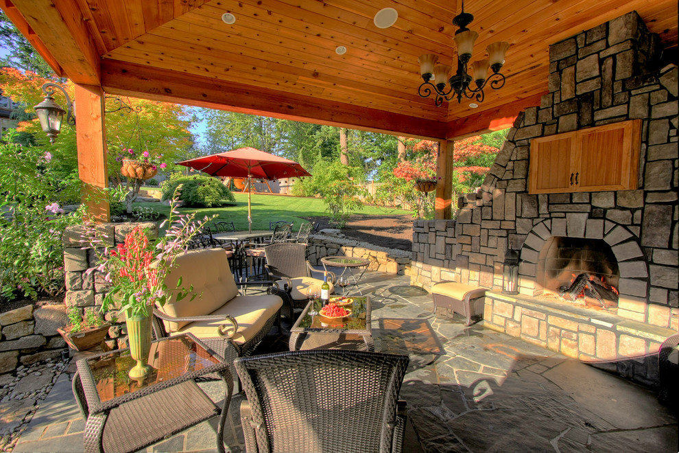 Example of a trendy patio design in Portland with a gazebo and a fire pit