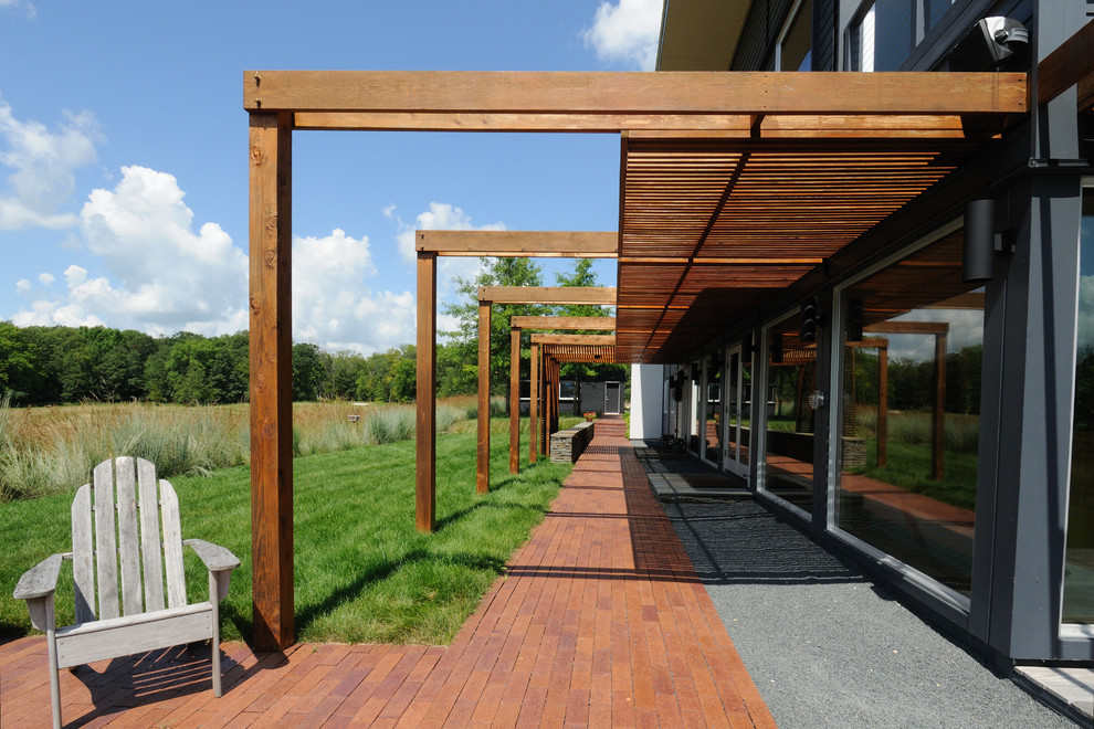 Inspiration for a contemporary patio remodel in Minneapolis with a pergola