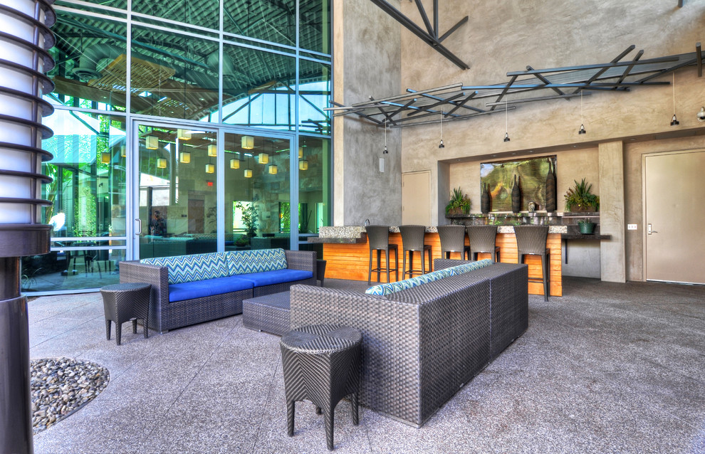 Contemporary patio in Orange County with a bar area.