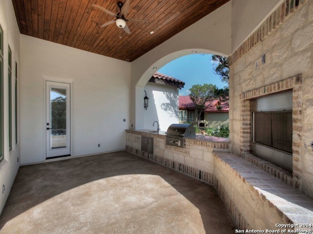 Example of a tuscan patio design in Austin