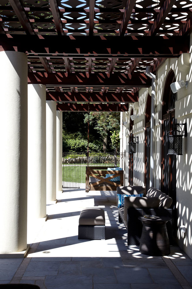 Photo of a mediterranean back patio in New York with a pergola.