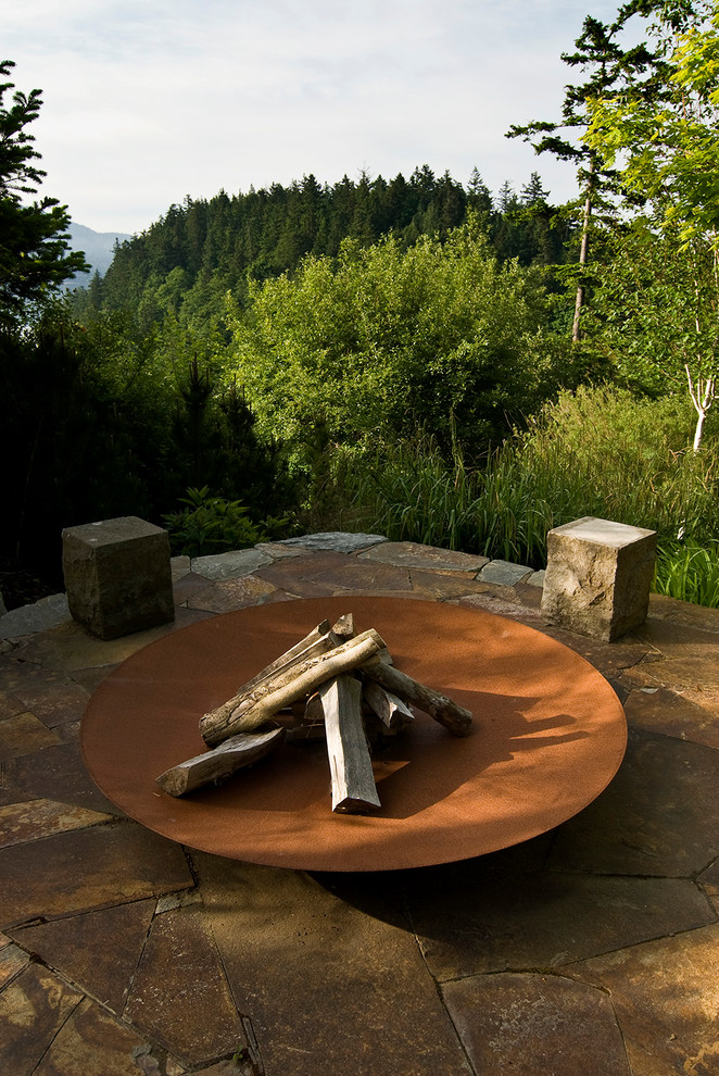 Inspiration for a timeless patio remodel in Seattle with a fire pit