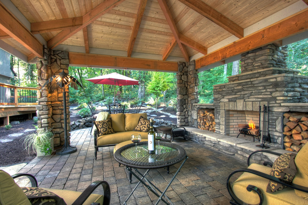 Inspiration for a rustic patio remodel in Portland with a gazebo and a fire pit