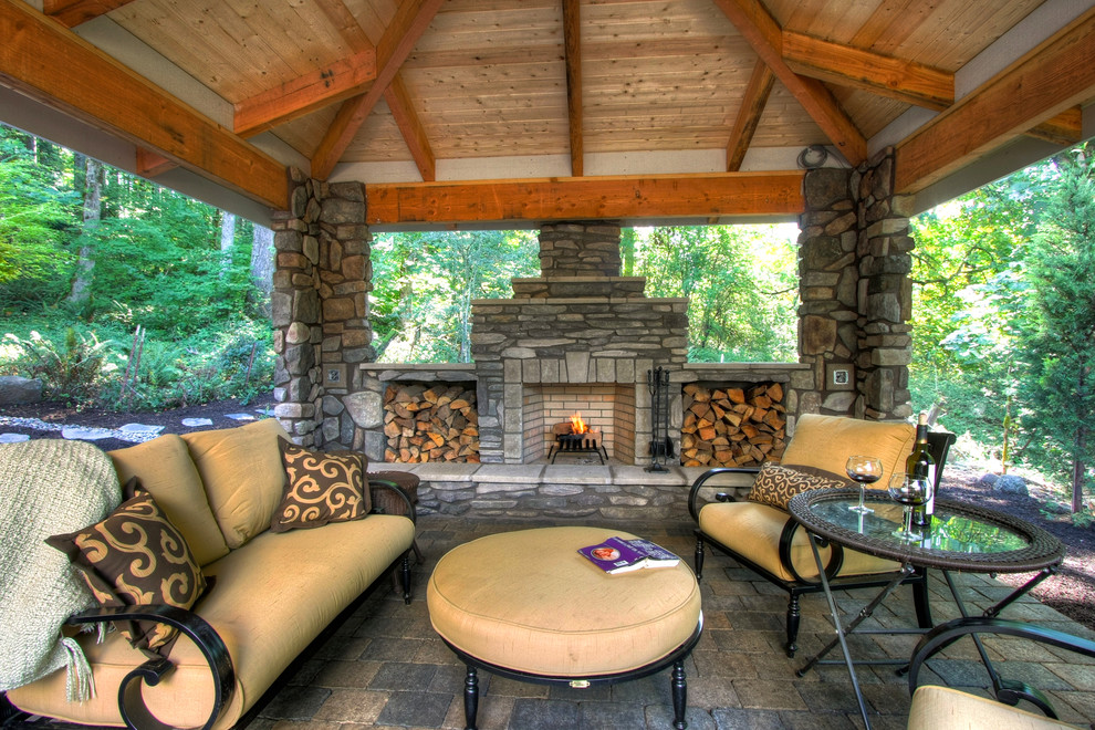 Example of a mountain style patio design in Portland with a gazebo and a fire pit