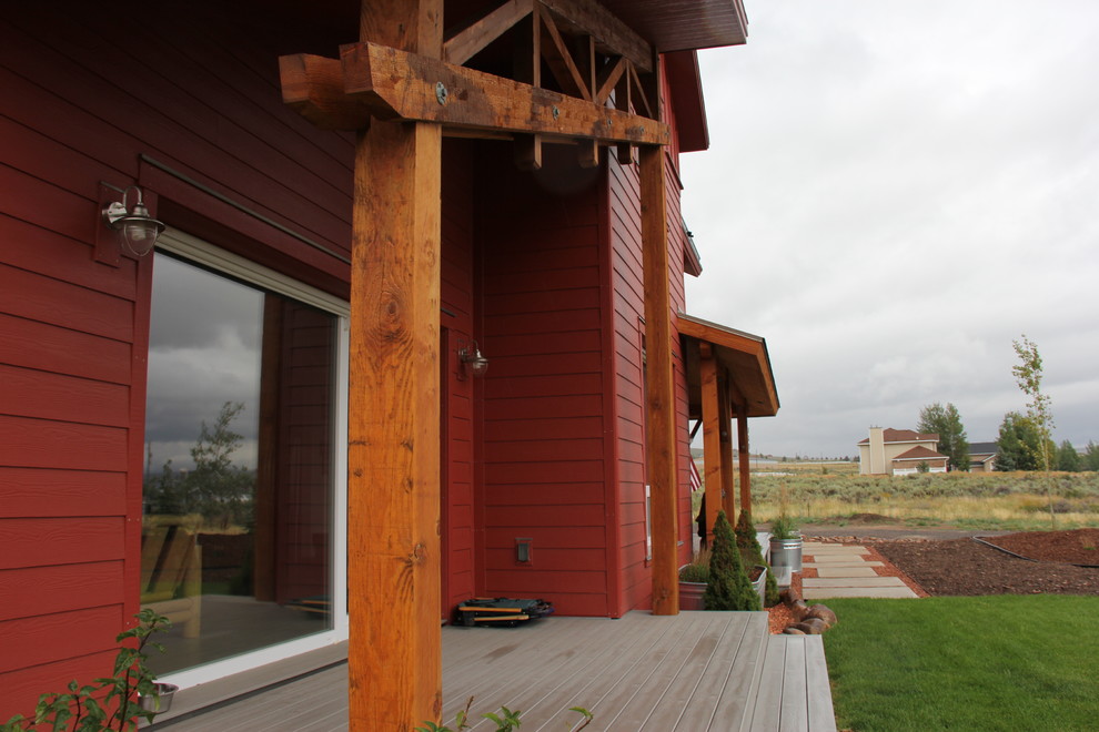 Inspiration pour une terrasse en bois avant rustique de taille moyenne avec une extension de toiture.