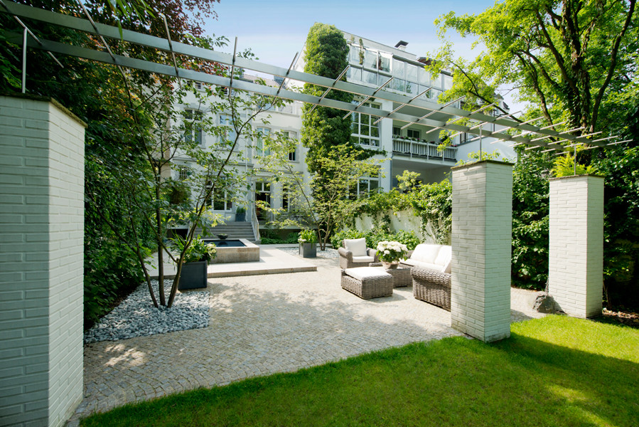 This is an example of a large contemporary back patio in Dusseldorf.