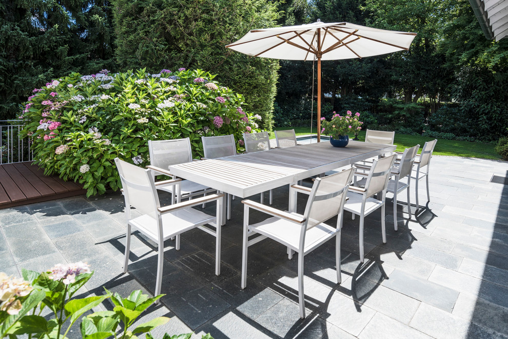 Large elegant side yard patio photo in Stuttgart with no cover