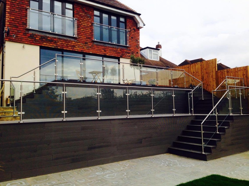 Photo of a large contemporary back patio in West Midlands with no cover.