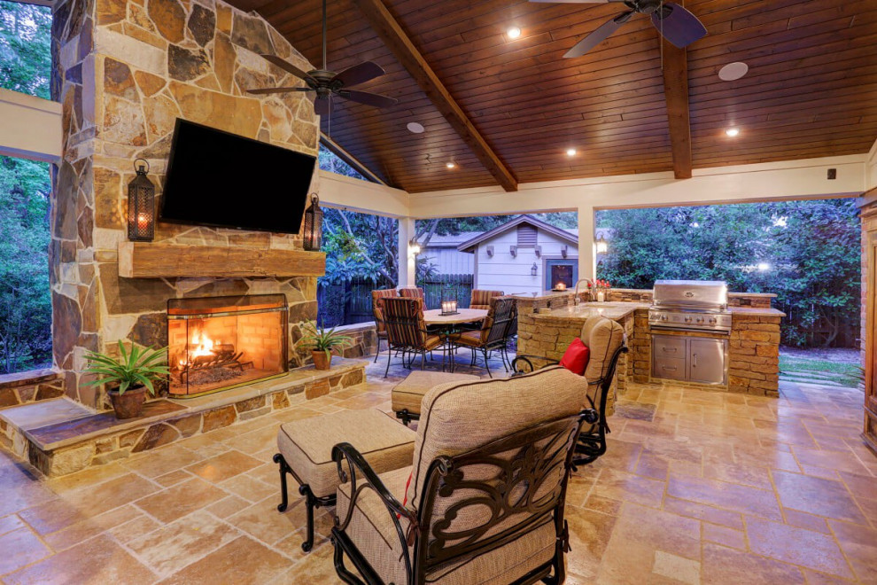 Small elegant backyard patio photo in Houston with a fireplace