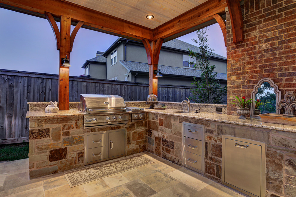 Expansive rustic back patio in Houston with a fire feature, tiled flooring and a roof extension.